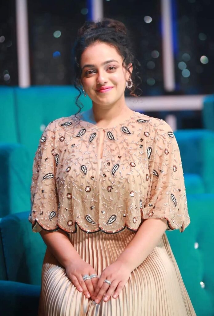 5 Best Glamorous Images of Nithya Menen, Top 5 Glamorous Photos of Nithya Menen, 5 Stunning Glamorous Looks of Nithya Menen, Nithya Menen's 5 Most Glamorous Images, 5 Gorgeous Glamorous Pictures of Nithya Menen, The Glamour of Nithya Menen: Top 5 Stunning Images, 